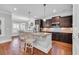Eat-in kitchen features granite counters, stainless steel appliances, dark cabinetry and bar stool seating at 700 Shell Point Ct., Longs, SC 29568