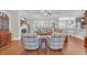 Bright, open living room boasts hardwood floors, fireplace, coffered ceiling, and comfortable seating area at 700 Shell Point Ct., Longs, SC 29568