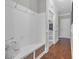Bright mudroom featuring bench with storage and hooks, and hardwood floors at 700 Shell Point Ct., Longs, SC 29568