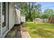 Spacious backyard features a well-kept lawn and various outbuildings, providing plenty of outdoor space at 708 15Th Ave., Conway, SC 29526