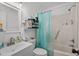 Bright bathroom with white vanity, shower-tub and teal accents at 708 15Th Ave., Conway, SC 29526