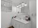 Well-lit bathroom with a vanity, large mirror, and modern fixtures at 708 15Th Ave., Conway, SC 29526