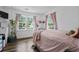 This cozy bedroom features two windows, hardwood floors and pink accents for a sweet, comfortable feel at 708 15Th Ave., Conway, SC 29526