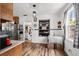 Open-concept dining area with a modern table, stylish decor, and abundant natural light at 708 15Th Ave., Conway, SC 29526