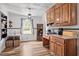 Bright and inviting kitchen featuring a dining area with seating, wooden cabinets, and hardwood floors at 708 15Th Ave., Conway, SC 29526