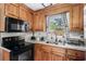 This remodeled kitchen features stainless steel appliances, updated countertops, and custom cabinetry at 708 15Th Ave., Conway, SC 29526