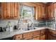 Close up of the kitchen sink with butcherblock countertops and wooden cabinets at 708 15Th Ave., Conway, SC 29526