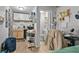 Compact kitchenette space with light cabinets, shelving and essentials, leading to a tidy, functional bathroom at 708 15Th Ave., Conway, SC 29526