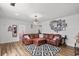 Spacious living room with a cozy seating area, hardwood floors, and unique decor at 708 15Th Ave., Conway, SC 29526