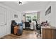 Well-lit home office with wood floors, large window, desk, and comfortable seating, perfect for working from home at 708 15Th Ave., Conway, SC 29526