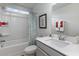 Well-lit bathroom featuring a shower-tub combination and a gray vanity with a bright white sink and counter at 7147 Shooting Star Way, Myrtle Beach, SC 29579