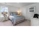 Serene bedroom with a comfortable bed, side tables, and a large window at 7147 Shooting Star Way, Myrtle Beach, SC 29579