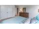 Relaxing bedroom featuring a bed, closet doors, and a dresser with a mirror at 7147 Shooting Star Way, Myrtle Beach, SC 29579