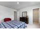Cozy bedroom featuring a bed with blue plaid bedding and neutral walls at 7147 Shooting Star Way, Myrtle Beach, SC 29579