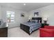 Charming bedroom with a queen bed, nautical decor, and a bright window at 7147 Shooting Star Way, Myrtle Beach, SC 29579