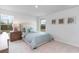 Inviting bedroom with a comfortable bed, a nightstand, and two bright windows at 7147 Shooting Star Way, Myrtle Beach, SC 29579