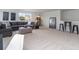 Spacious living room featuring a gray sectional sofa, patterned ottoman, and neutral carpet at 7147 Shooting Star Way, Myrtle Beach, SC 29579