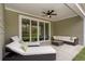 Relaxing patio with sun loungers, sofa, and sliding glass doors providing seamless indoor-outdoor living at 7176 Shooting Star Way, Myrtle Beach, SC 29579
