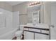 Bathroom featuring a shower-tub, toilet, vanity and mirror with lighting at 8658 Southbridge Dr. # L, Myrtle Beach, SC 29575