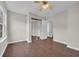 Bedroom features hardwood floors, closet with mirrors, and window views at 8658 Southbridge Dr. # L, Myrtle Beach, SC 29575