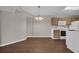 The dining area features wood floors and view of the kitchen at 8658 Southbridge Dr. # L, Myrtle Beach, SC 29575