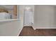 The entryway features wood floors, neutral paint, and a view into the kitchen at 8658 Southbridge Dr. # L, Myrtle Beach, SC 29575