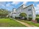 Exterior of property featuring well maintained landscaping and sidewalk at 8658 Southbridge Dr. # L, Myrtle Beach, SC 29575
