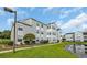 The condo features well-manicured landscaping, green grass and a view of the pond at 8658 Southbridge Dr. # L, Myrtle Beach, SC 29575