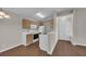 The kitchen features white appliances and light wood cabinets at 8658 Southbridge Dr. # L, Myrtle Beach, SC 29575