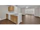 The kitchen features a breakfast bar, white appliances and light wood cabinets at 8658 Southbridge Dr. # L, Myrtle Beach, SC 29575