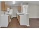 The kitchen features white appliances, light wood cabinets, and a breakfast bar at 8658 Southbridge Dr. # L, Myrtle Beach, SC 29575