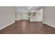 Spacious living area with wood floors, flowing seamlessly into the kitchen at 8658 Southbridge Dr. # L, Myrtle Beach, SC 29575