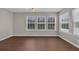 Bright sun room features wood floors and three large windows at 8658 Southbridge Dr. # L, Myrtle Beach, SC 29575