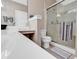 Bright bathroom featuring a glass shower and stylish countertop at 876 Palmetto Trail # 103, Myrtle Beach, SC 29577