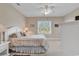 Bright bedroom with carpet, ceiling fan, and sunny window at 876 Palmetto Trail # 103, Myrtle Beach, SC 29577