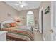 Comfortable bedroom with a window with shutter blinds, a colorful bed, and a classic ceiling fan at 876 Palmetto Trail # 103, Myrtle Beach, SC 29577