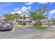 Inviting condominium exterior featuring a two-story design with charming balconies and well-maintained landscaping at 876 Palmetto Trail # 103, Myrtle Beach, SC 29577
