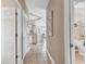 Inviting hallway with tile floors leading to the kitchen and a glimpse of the bathroom at 876 Palmetto Trail # 103, Myrtle Beach, SC 29577