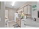 Cozy kitchen featuring neutral cabinets, tile backsplash, and modern appliances at 876 Palmetto Trail # 103, Myrtle Beach, SC 29577