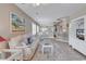 Inviting living room featuring a large sofa, beach-themed decor, and open layout to the dining area at 876 Palmetto Trail # 103, Myrtle Beach, SC 29577