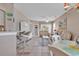 Open-concept living area with tile floors, neutral tones, and a view to dining area at 876 Palmetto Trail # 103, Myrtle Beach, SC 29577