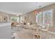 Comfortable living area with ample seating, tile flooring, and plenty of natural light at 876 Palmetto Trail # 103, Myrtle Beach, SC 29577