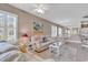 Inviting living room with bright decor, tile floors, and an open layout to the dining area at 876 Palmetto Trail # 103, Myrtle Beach, SC 29577