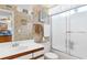 Bathroom featuring a pristine white vanity with a frosted glass shower door at 8861 Chandler Dr. # F, Surfside Beach, SC 29575