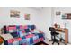 Bright bedroom with a futon, ceiling fan, and a small desk workspace at 8861 Chandler Dr. # F, Surfside Beach, SC 29575