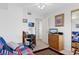 Bright bedroom features a futon, ceiling fan, desk and closet at 8861 Chandler Dr. # F, Surfside Beach, SC 29575