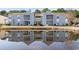 Charming condo complex reflected beautifully in the adjacent community pond at 8861 Chandler Dr. # F, Surfside Beach, SC 29575