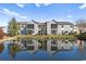 Condo complex with a scenic pond view and lush landscaping at 8861 Chandler Dr. # F, Surfside Beach, SC 29575