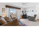 Sunlit living room with comfortable seating and sliding doors that open to a balcony at 8861 Chandler Dr. # F, Surfside Beach, SC 29575