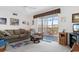 Bright living room with a sofa and recliner near a sliding glass door that fills the space with light at 8861 Chandler Dr. # F, Surfside Beach, SC 29575